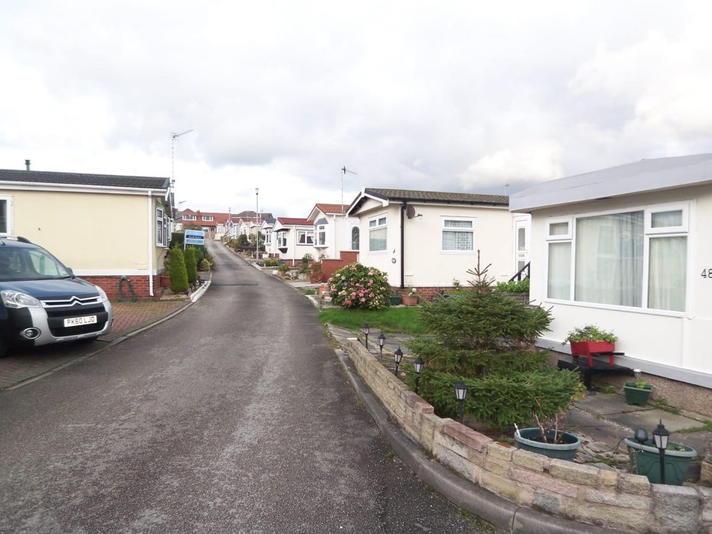 http://A%20road%20of%20lodges%20from%20Nelson%20Park%20Lodges